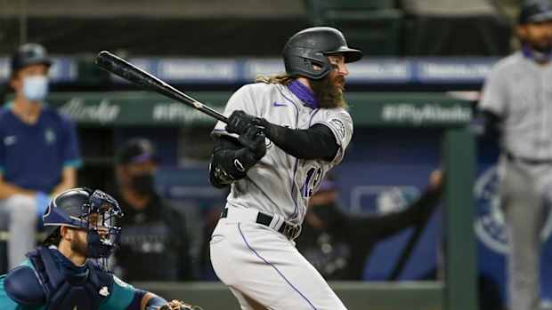 Aug 7, 2020; Seattle, Washington, USA; Colorado Rockies right fielder Charlie Blackmon (19) hits a single against the Seattle Mariners during the third inning at T-Mobile Park. Mandatory Credit: Joe Nicholson-USA TODAY Sports